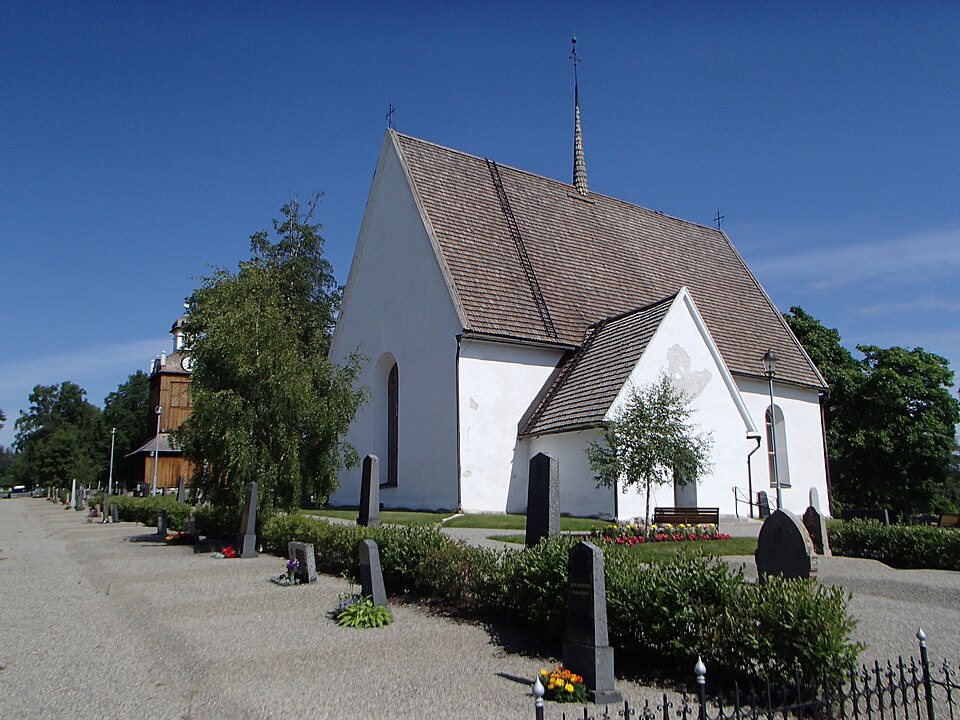 The church building and belfry of "Grundsunda kyrka" in Grundsunda, Örnsköldsvik Municipality, viewed from southwest