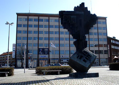 The sculpture "Till Axel Danielsson" by Willy Gordon 1973, situated in the Nobeltorget square in the city of Malmo. In the background is Folkets hus.