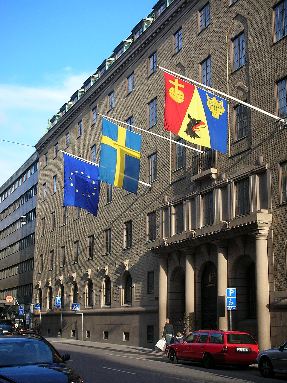 The seat of the County Administrative Board of the Stockholm County, at Hantverkargatan 29 in Sweden. The flags are (from left to right), the European flag, the flag of Sweden and the flag of the Coun