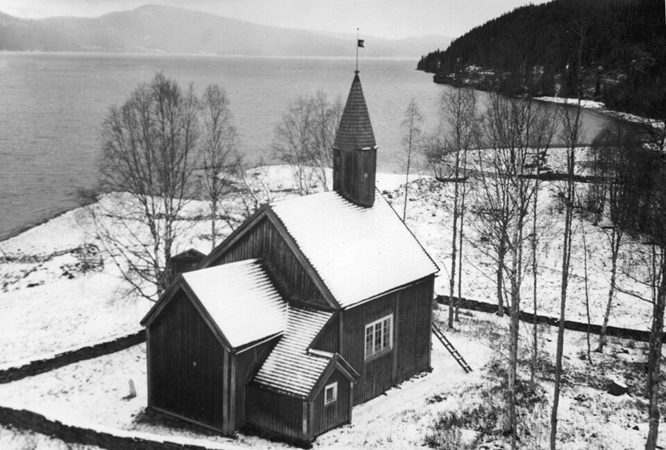 Viken chapel by lake Kvarnbergsvattnet. The wooden chapel was originally built in 1793 by Norwegian settlers. It has been rebuilt and restored several times. Architect Gösta Rollin (who took the image