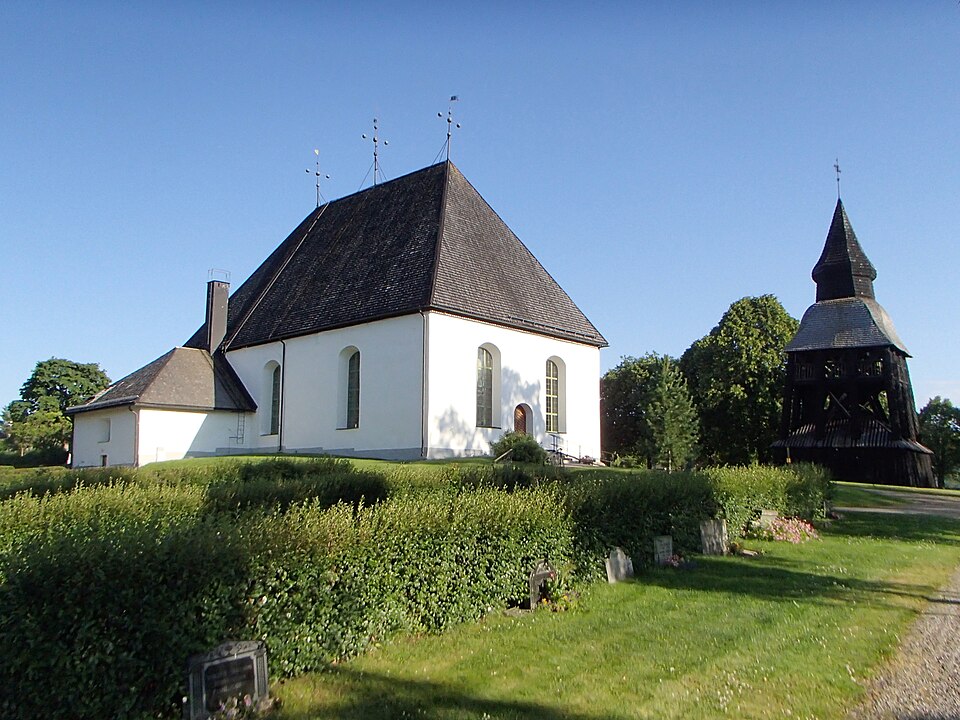 The church and bell tower buildings of "Bjuråkers kyrka" at Söderblomsvägen 12 in Bjuråker, Hudiksvall Municipality